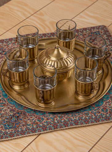 Brass tea set with 6 tea cups and 1 sugar bowl in tea tray