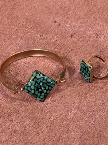 A set of rings and bracelets with a turquoise Inlaying gem