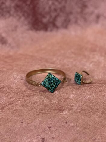 A set of rings and bracelets with a turquoise Inlaying gem