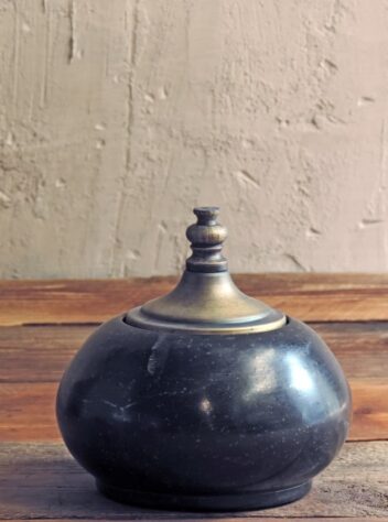 Set of three stone jars with brass lids