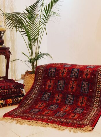 Turkmen tribal red rug with vase design