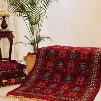 Turkmen tribal red rug with vase design