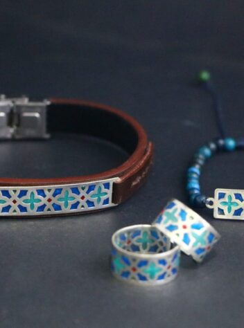 of leather bracelet, ring and chain bracelet with silver colored tile design plate