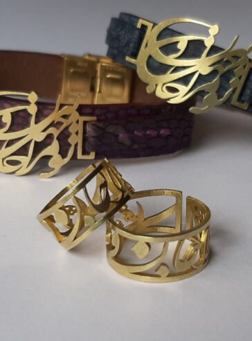 A set of rings and bracelets with a brass writing plate