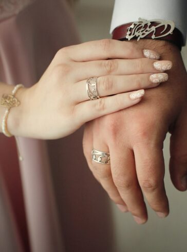 A set of rings and bracelets with a brass writing plate