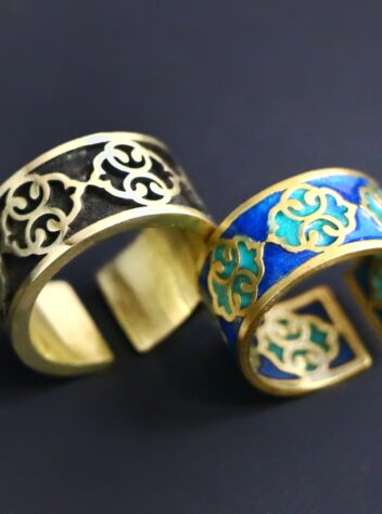 A set of brass rings and bracelets with tile designs