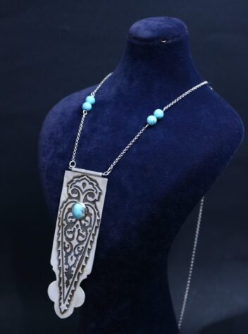 set of Silver earrings with a bush pattern and a tree of life Silver necklace with turquoise gems