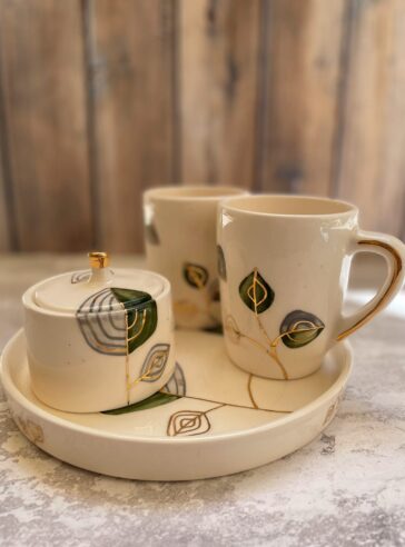 Set of mugs, tray and sugar bowl with a raised pattern,11 carat gold luster