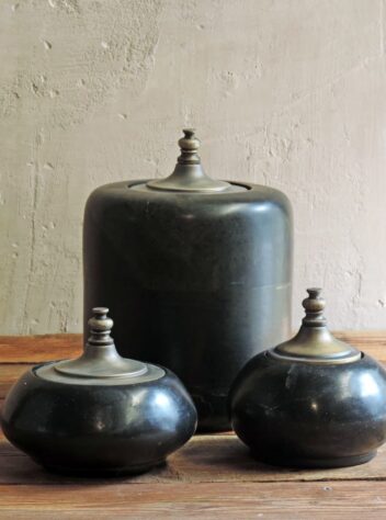 Set of three stone jars with brass lids